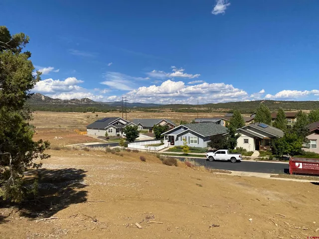 a view of a backyard of the house