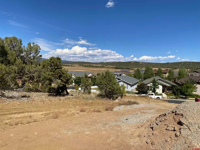 a view of a lake with houses in the background