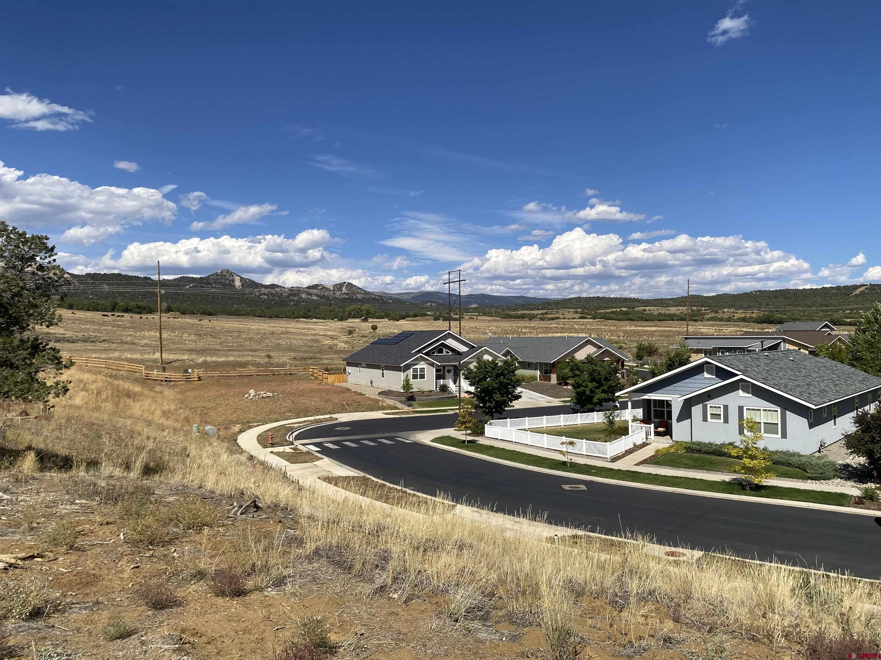 481 Oxbow Circle Durango, CO 81301 - Photo 10 of 16 a view of a lake with houses in the background
