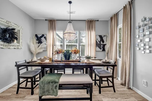 a view of a dining room with furniture window and outside view