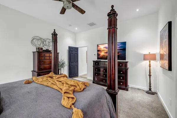 a bedroom with a bed and furniture