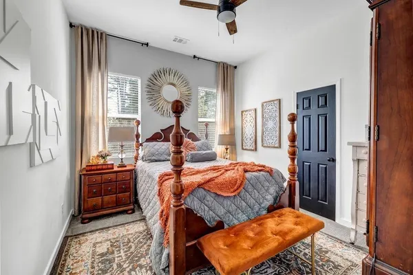 a bedroom with furniture and a window