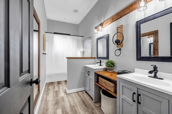 a room with a sink and a mirror