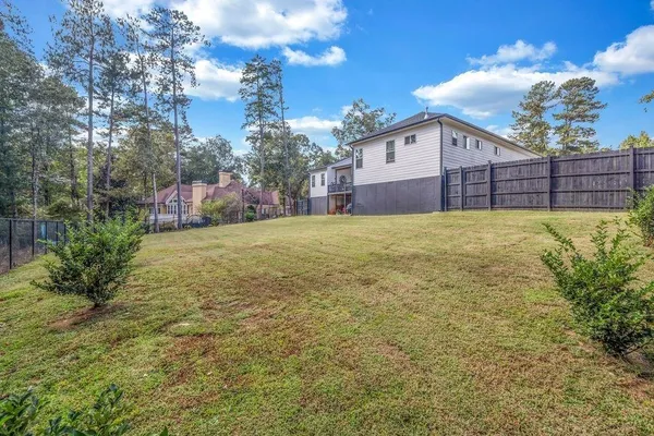 a view of a backyard of the house