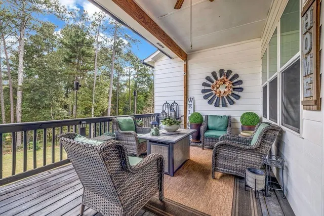 a view of a balcony with furniture