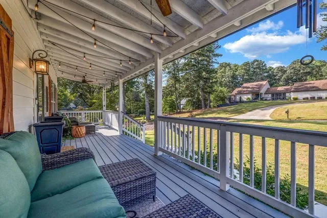a view of balcony with wooden floor
