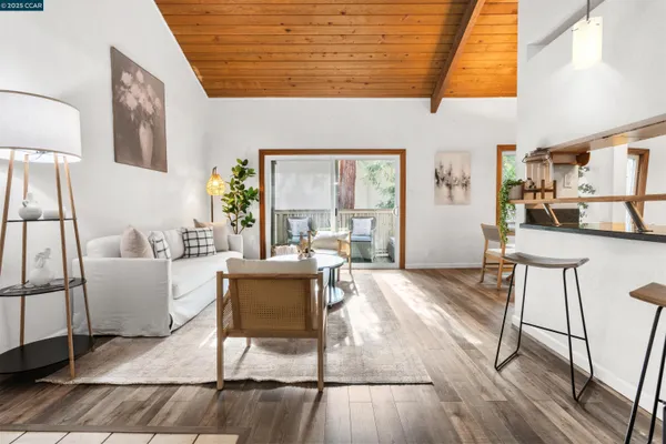 a living room with fireplace furniture and a wooden floor