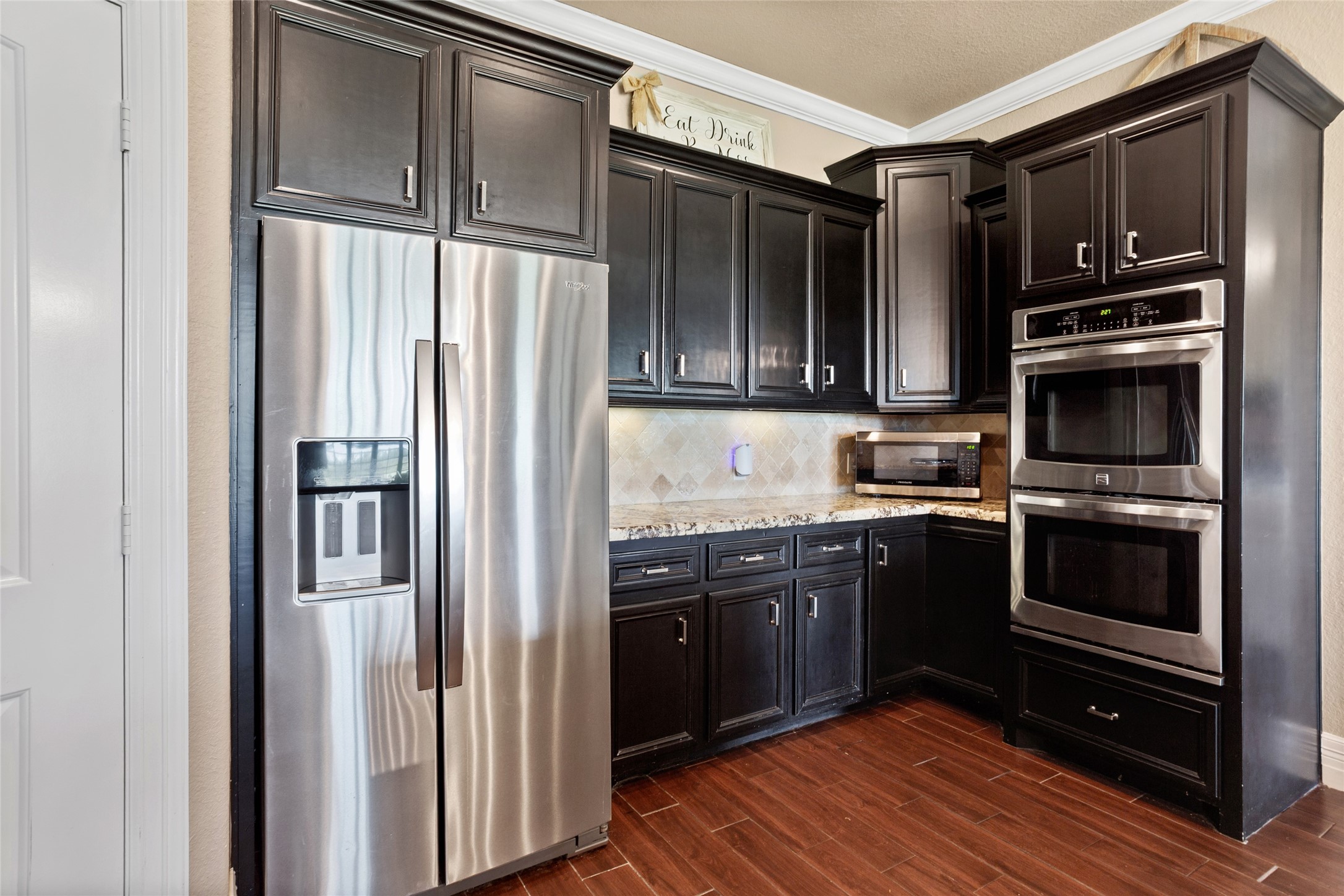 7842 Pebble Hill Lane Rosharon, TX 77583 - Photo 13 of 33 a kitchen with stainless steel appliances granite countertop a refrigerator and a stove top oven