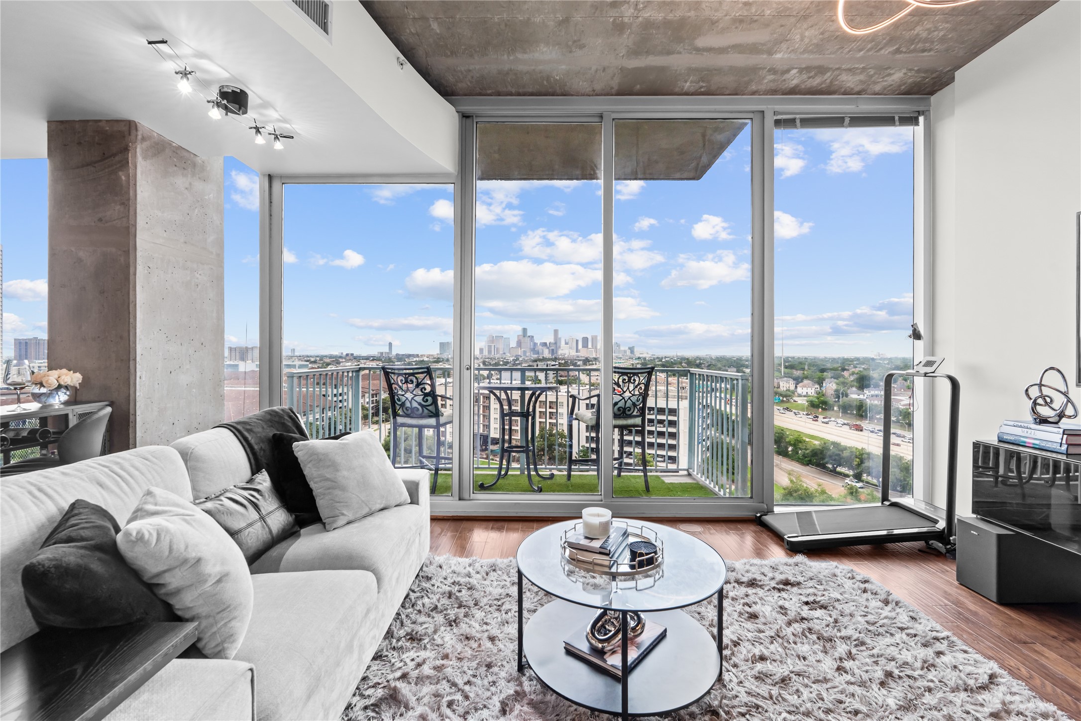 5925 Almeda Road, Unit 11107 Houston, TX 77004 - Photo 12 of 45 a living room with furniture and a floor to ceiling window