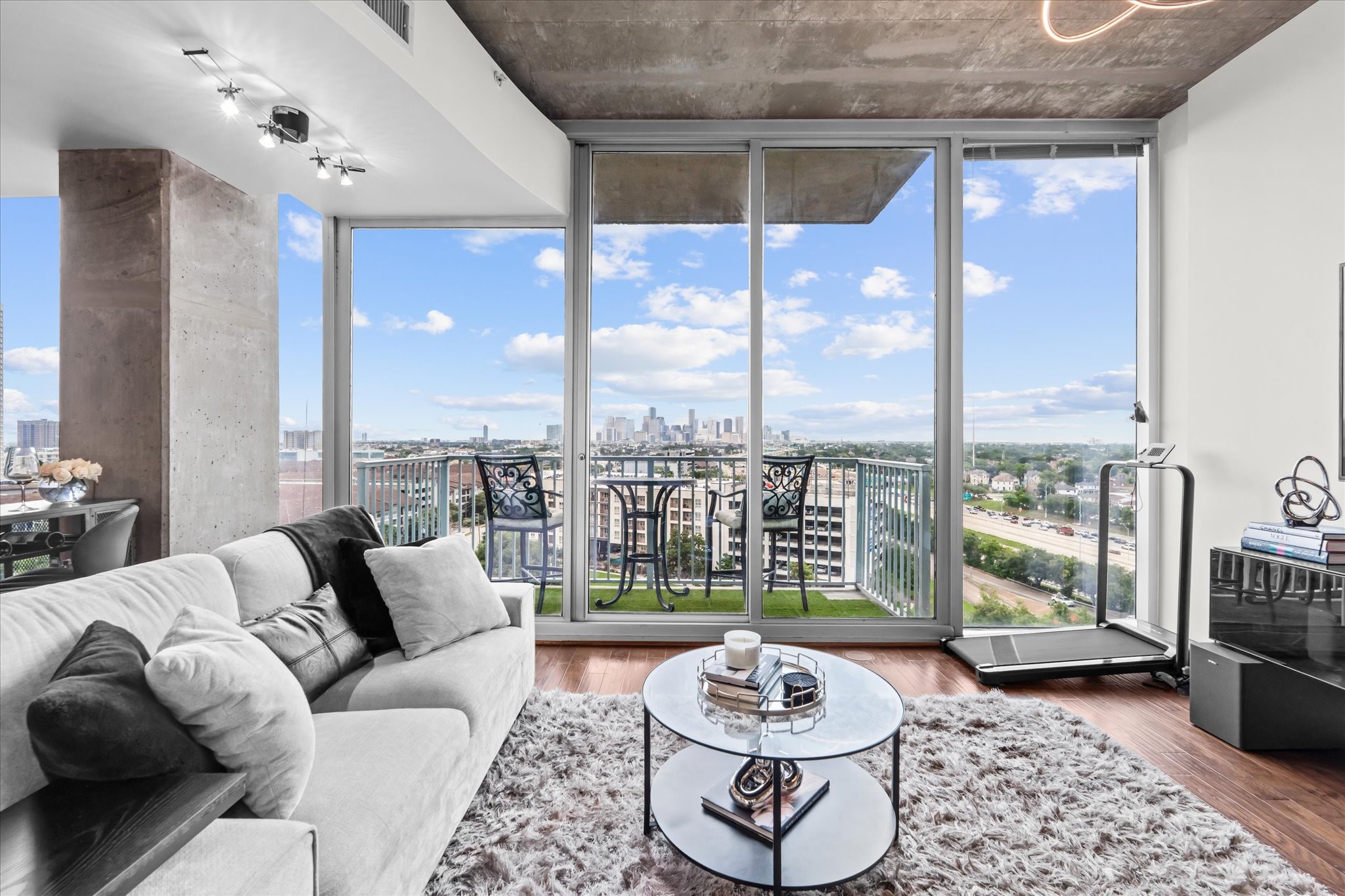 5925 Almeda Road, Unit 11107 Houston, TX 77004 - Photo 2 of 45 a living room with furniture and a floor to ceiling window