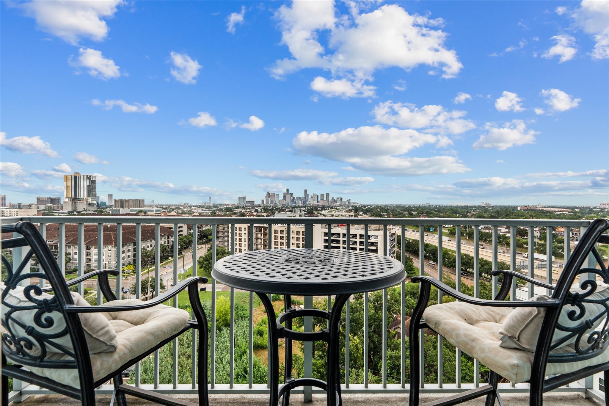5925 Almeda Road, Unit 11107 Houston, TX 77004 - Photo 24 of 45 a view of a chairs and table in the balcony