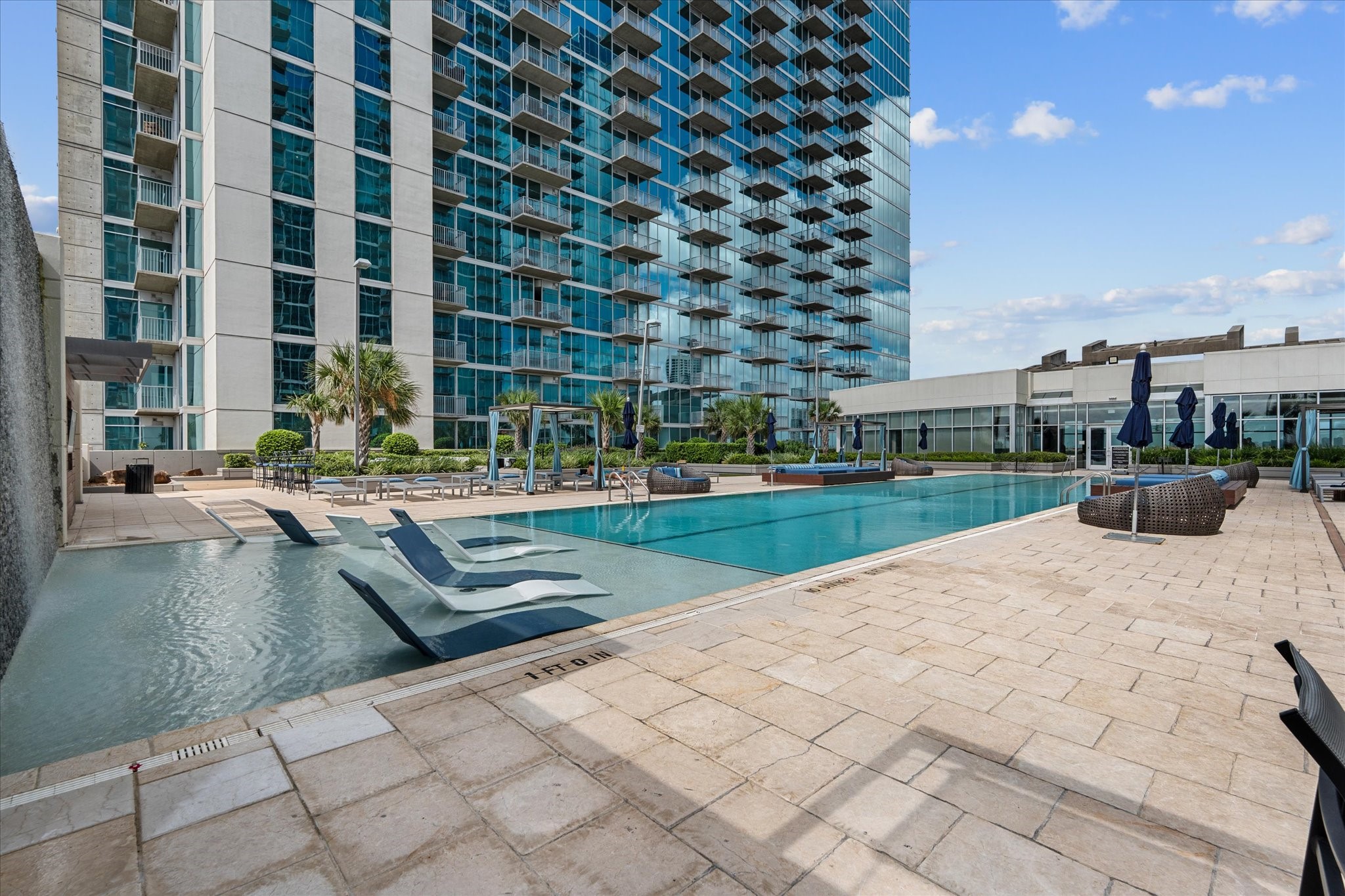 5925 Almeda Road, Unit 11107 Houston, TX 77004 - Photo 28 of 45 a swimming pool with outdoor seating and yard