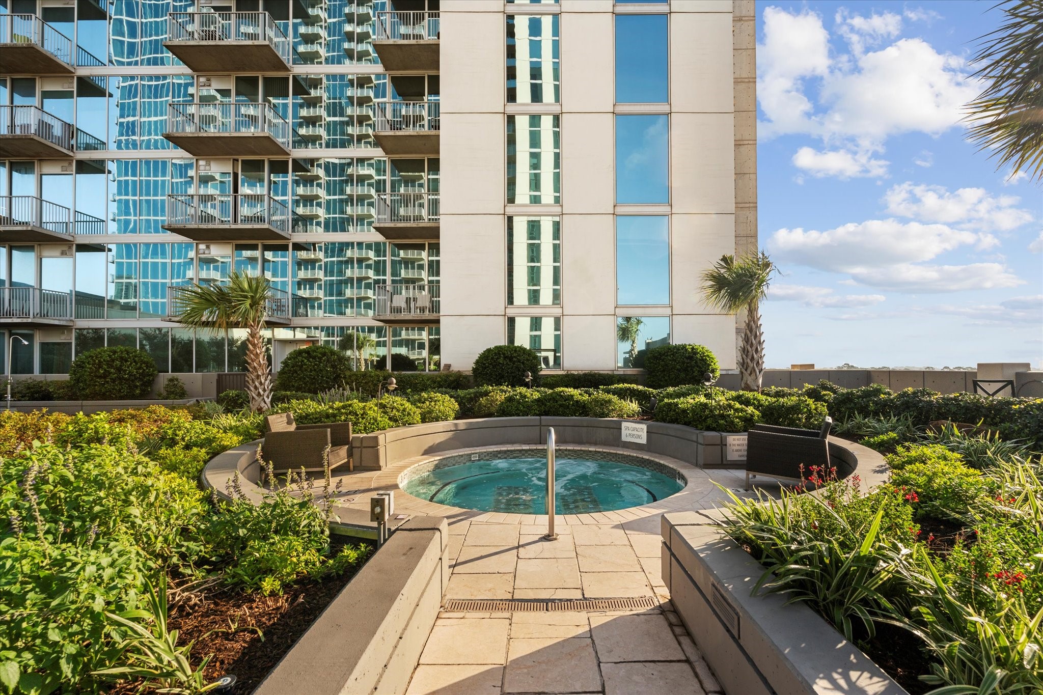 5925 Almeda Road, Unit 11107 Houston, TX 77004 - Photo 29 of 45 a view of a patio with couches and potted plants