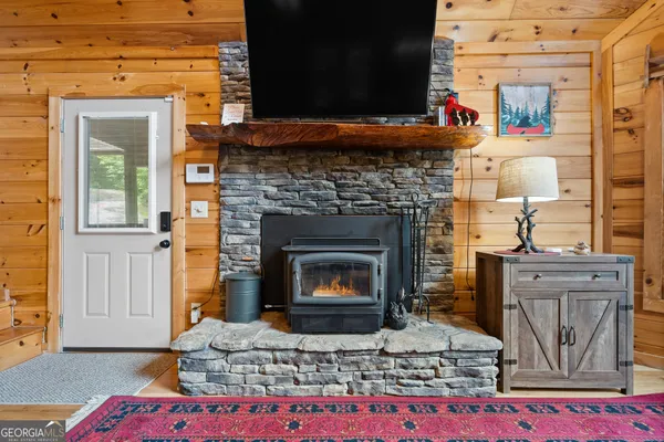a kitchen with stainless steel appliances granite countertop a sink refrigerator and cabinets