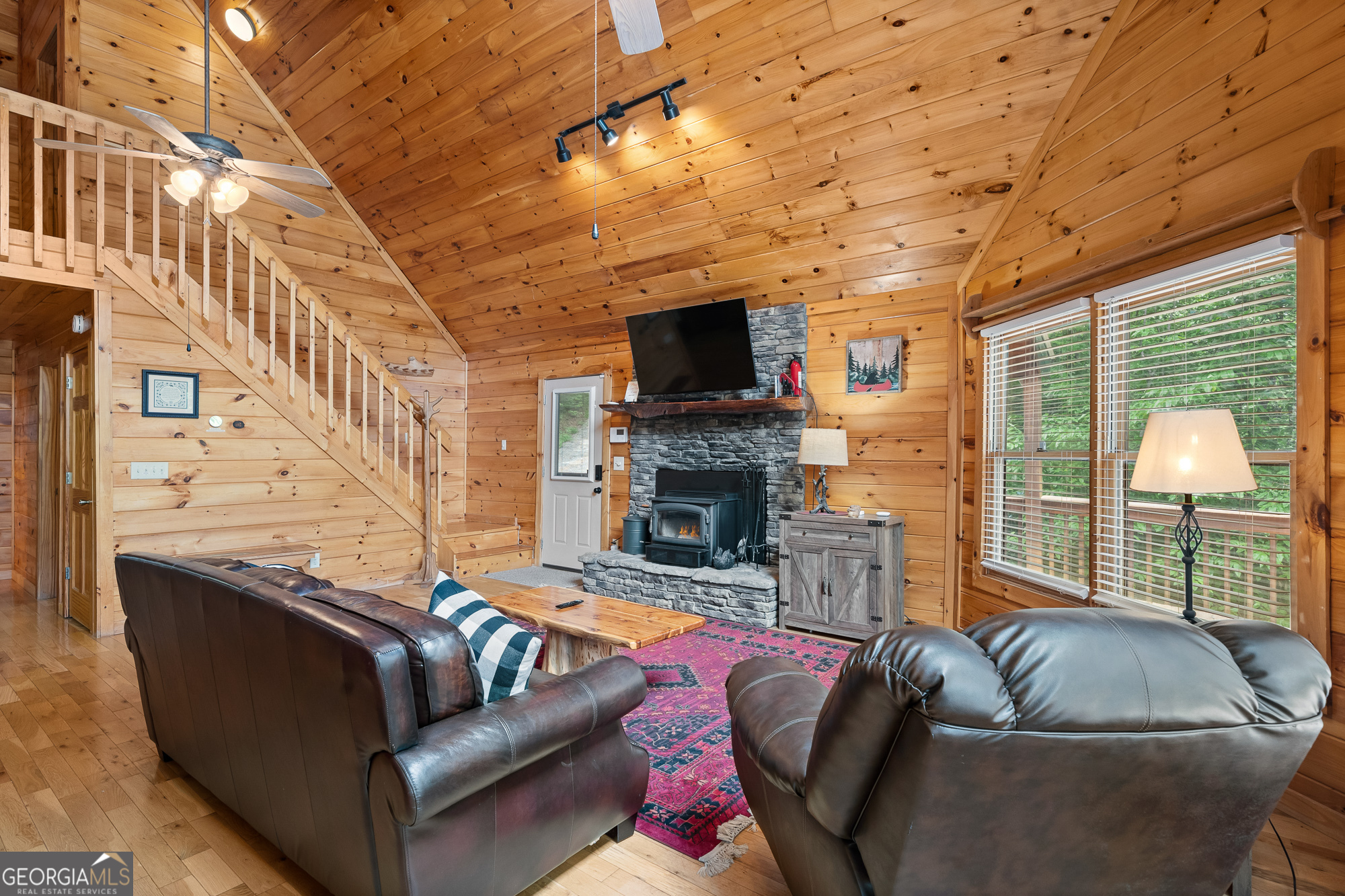 476 Prince Mountain Road Cherry Log, GA 30522 - Photo 14 of 80 a living room with furniture a flat screen tv and a fireplace
