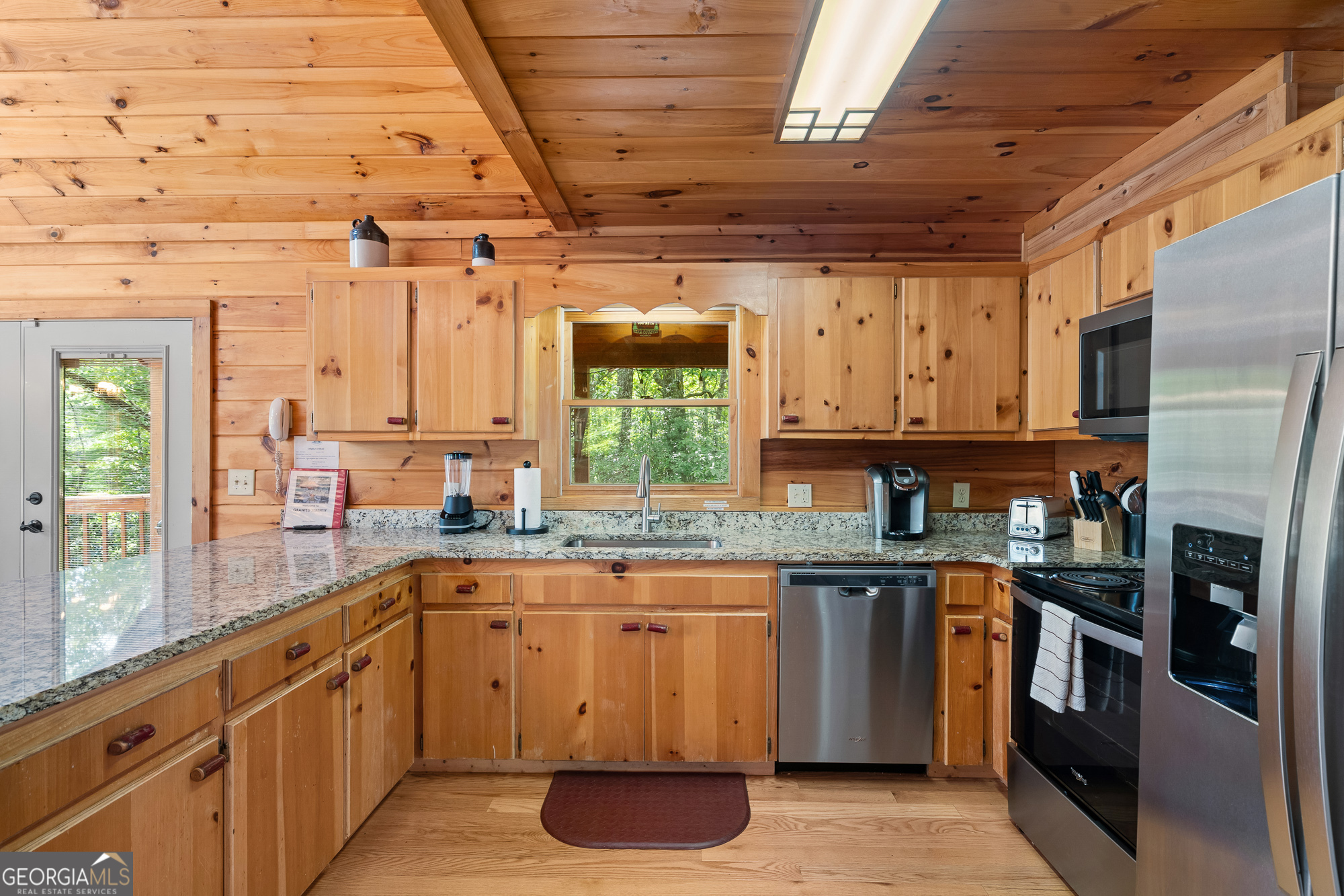 476 Prince Mountain Road Cherry Log, GA 30522 - Photo 21 of 80 a kitchen with stainless steel appliances granite countertop a sink a stove and refrigerator