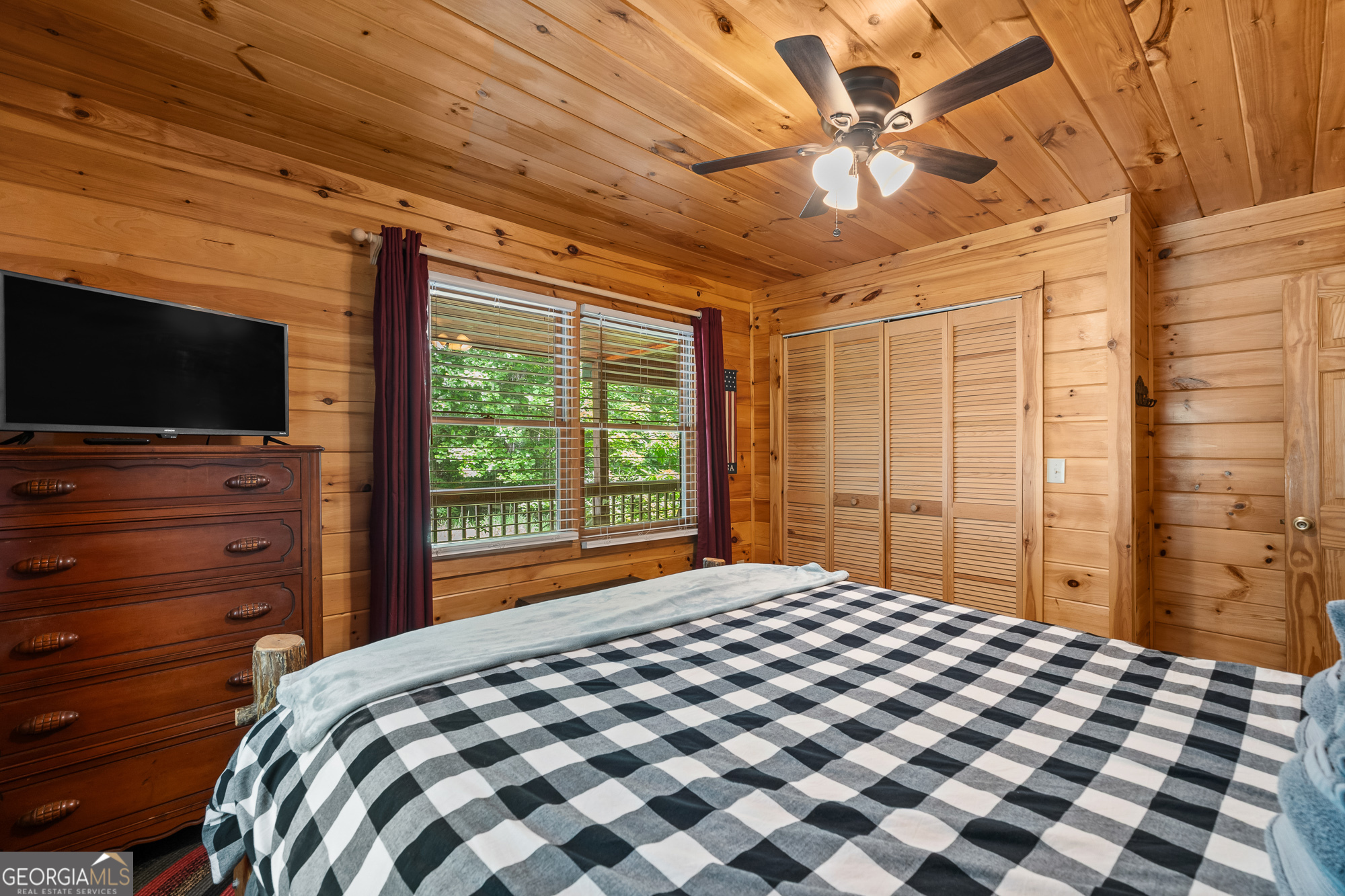 476 Prince Mountain Road Cherry Log, GA 30522 - Photo 25 of 80 a bedroom with a bed and a flat screen tv