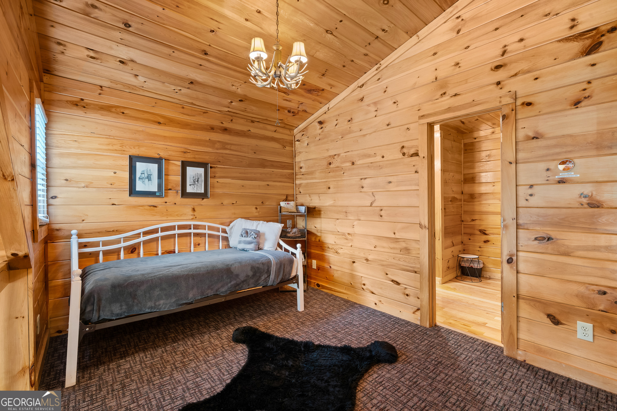 476 Prince Mountain Road Cherry Log, GA 30522 - Photo 31 of 80 a bedroom with a bed and a view of walk in closet