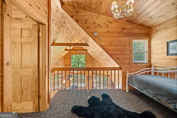 a view of an entryway with wooden floor and windows