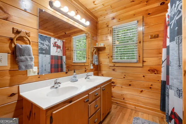 a view of a patio with a table chairs and a backyard