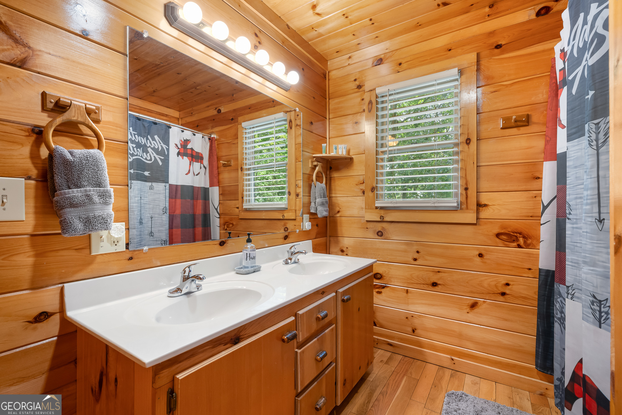 476 Prince Mountain Road Cherry Log, GA 30522 - Photo 39 of 80 a bathroom with a sink mirror and a bathtub