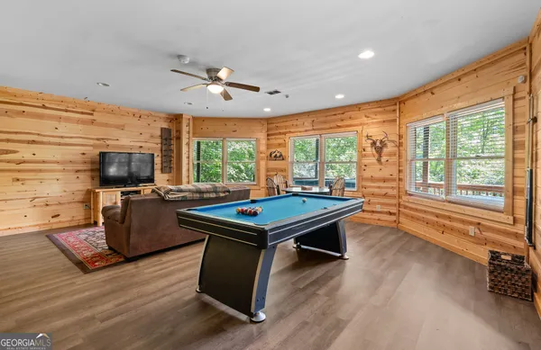 a view of balcony with wooden floor and outdoor seating