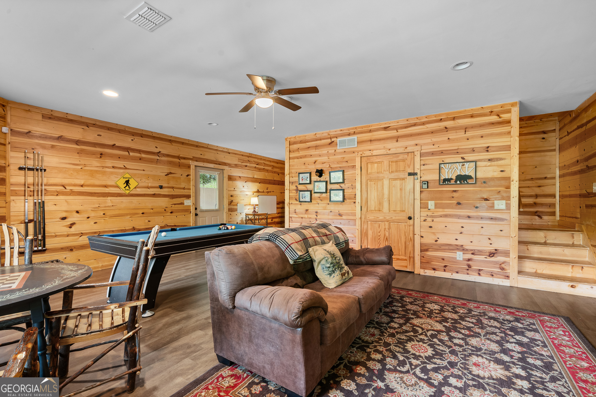 476 Prince Mountain Road Cherry Log, GA 30522 - Photo 43 of 80 a living room with furniture a ceiling fan and a rug