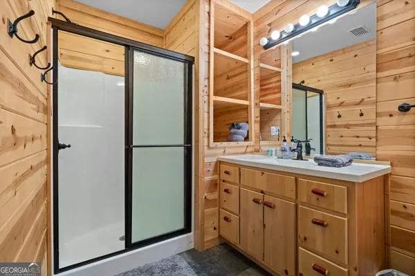 a backyard of a house with lots of green space and trees