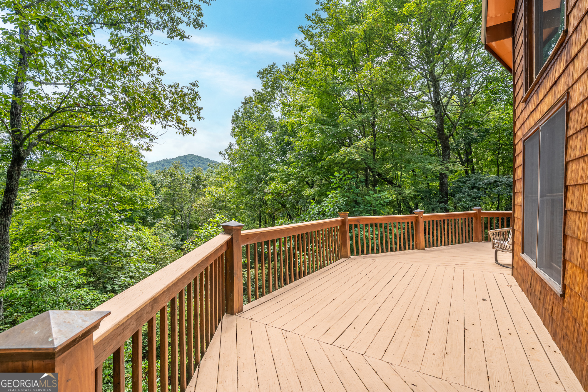 476 Prince Mountain Road Cherry Log, GA 30522 - Photo 50 of 80 a balcony with trees in front of it