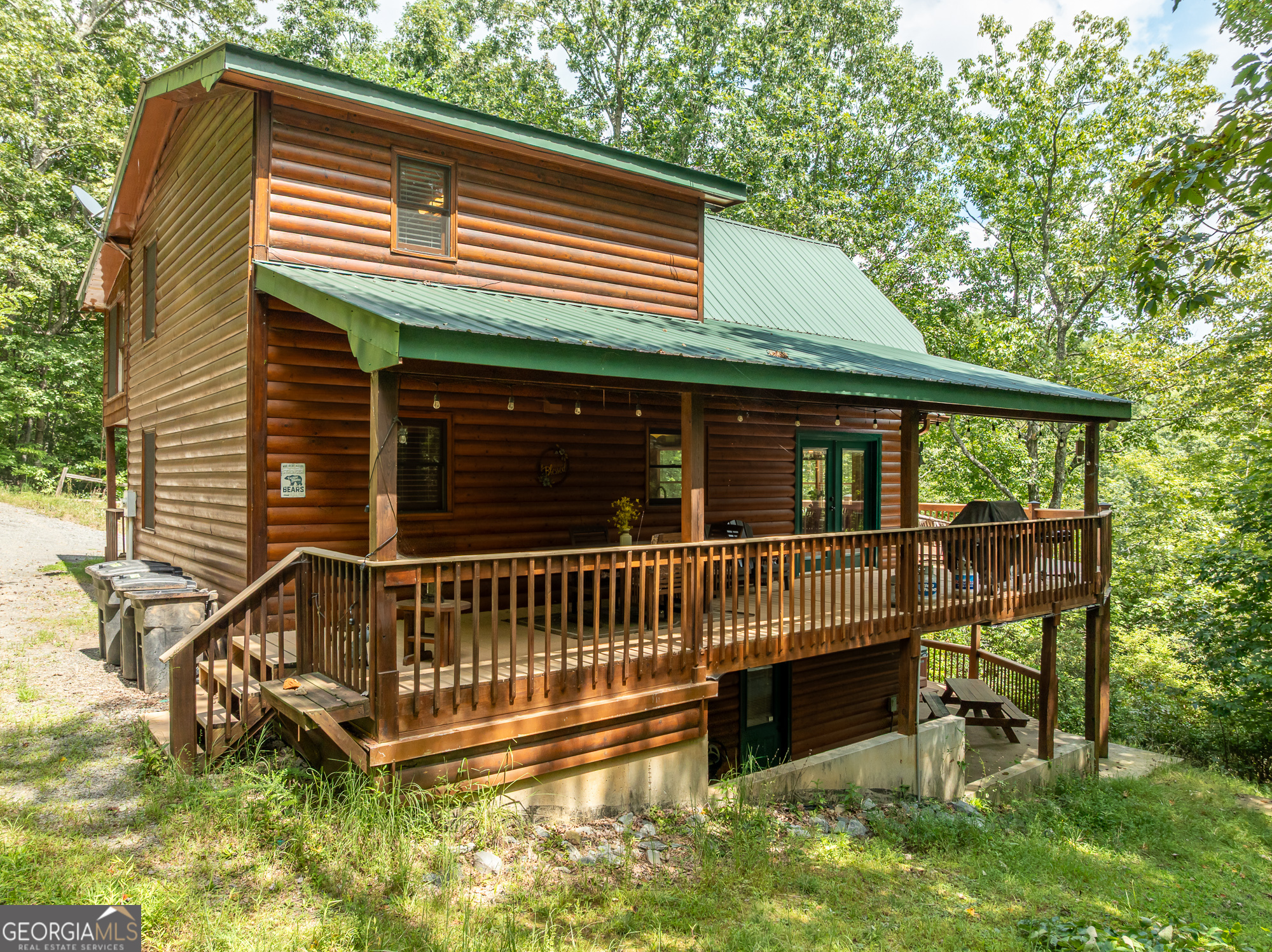 476 Prince Mountain Road Cherry Log, GA 30522 - Photo 5 of 80 a view of a house with a deck and a yard