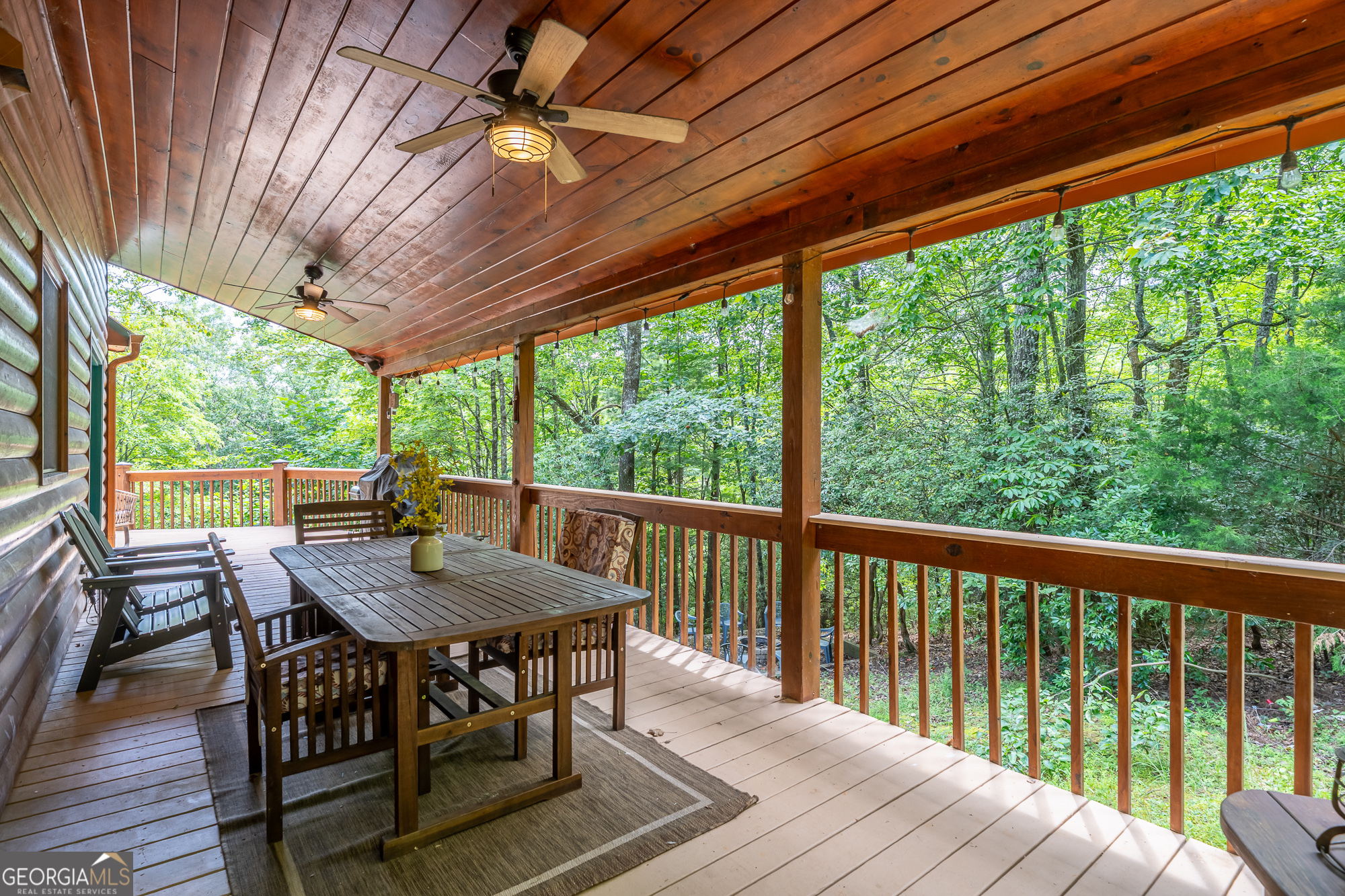 476 Prince Mountain Road Cherry Log, GA 30522 - Photo 53 of 80 a view of a patio with a table chairs and a backyard