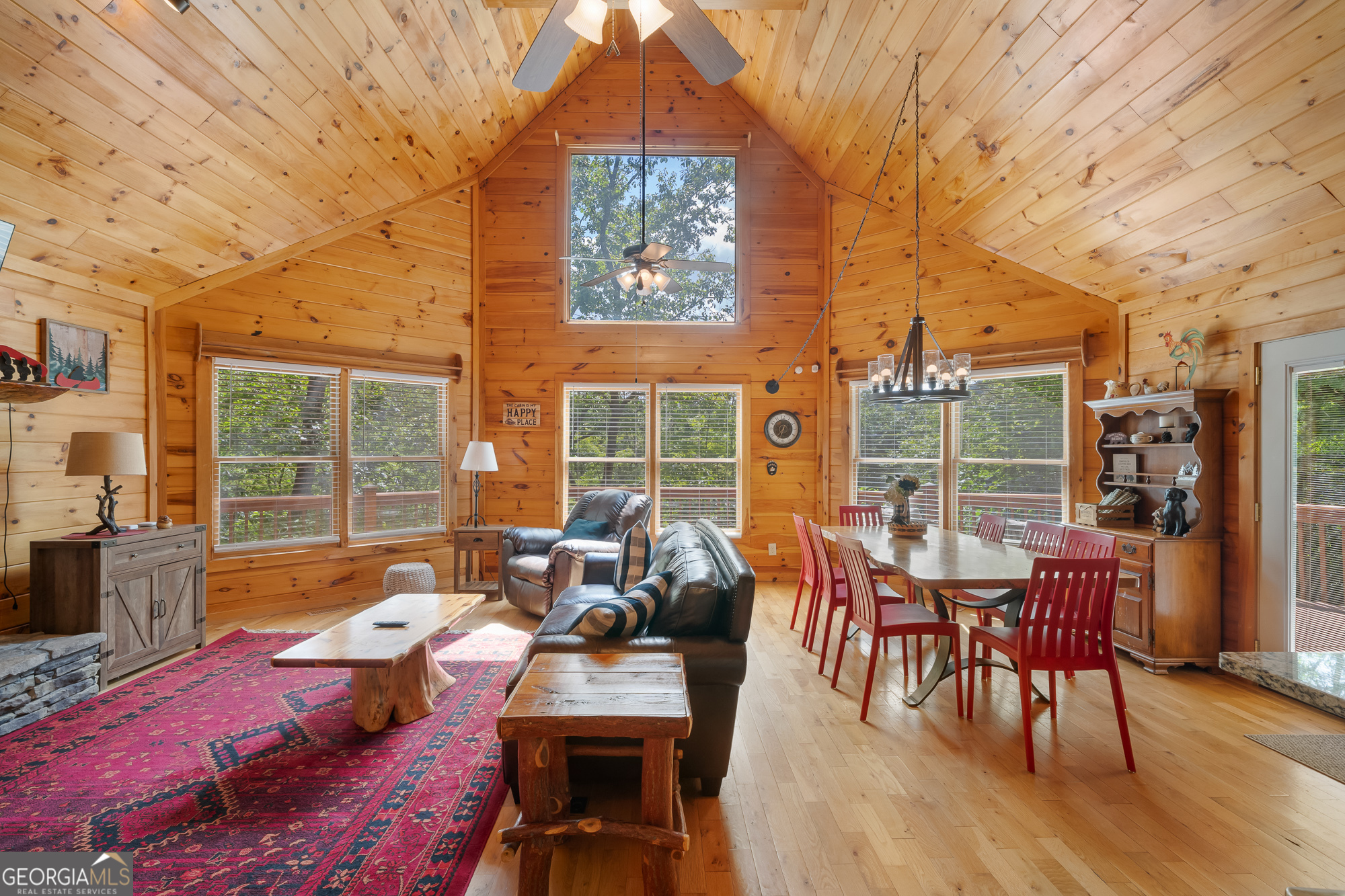 476 Prince Mountain Road Cherry Log, GA 30522 - Photo 10 of 80 a living room with furniture a large window and wooden floor