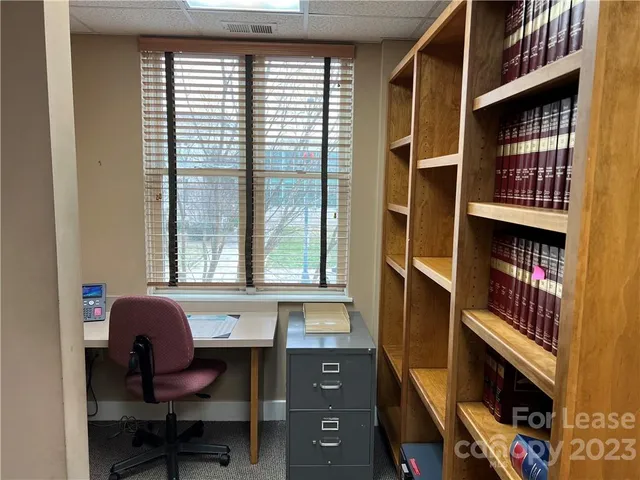 a workspace with furniture and window