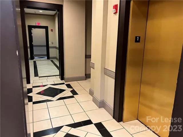 a bathroom with a mirror and a shower