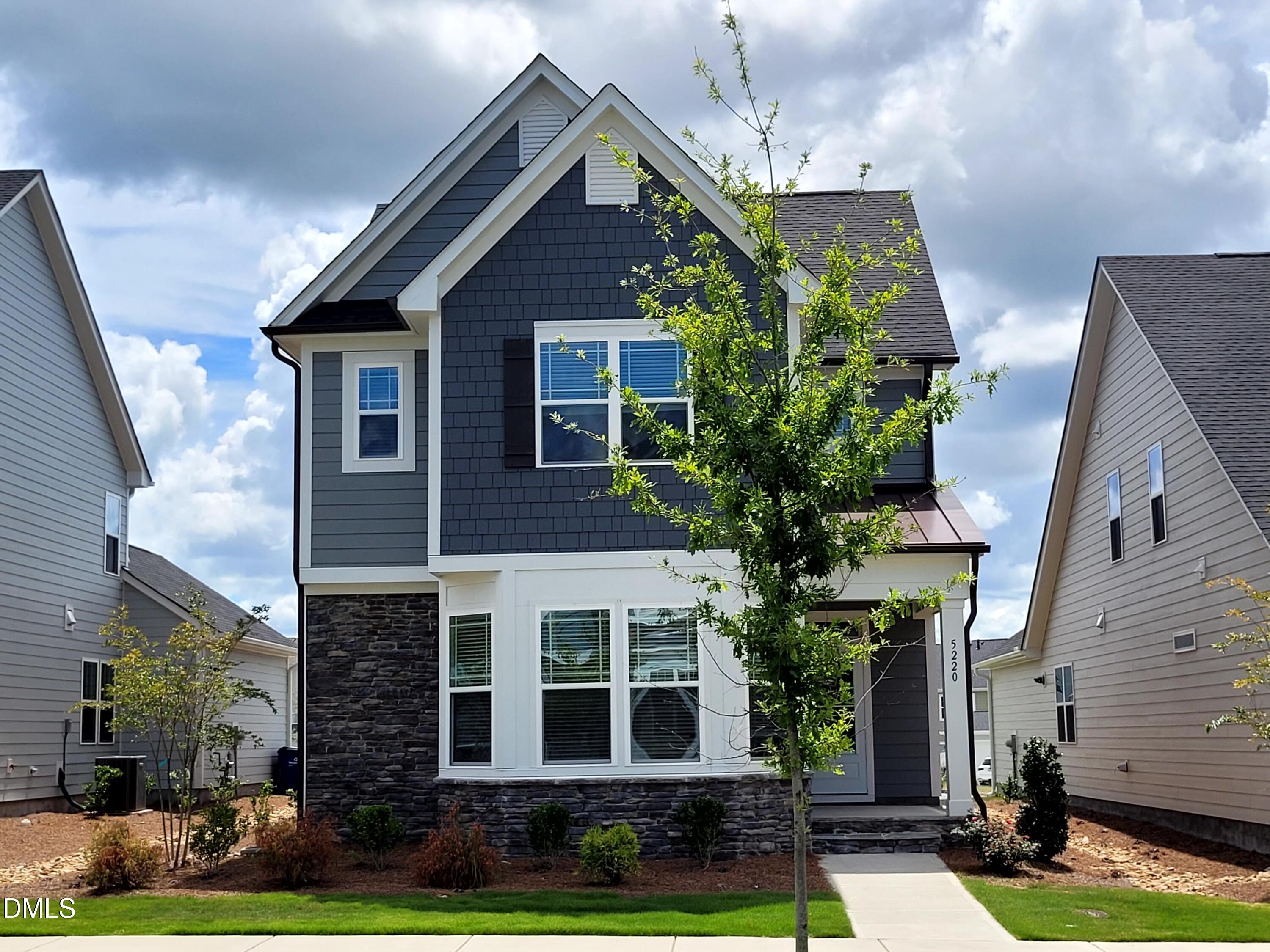 5220 Influence Way Raleigh, NC 27616 - Photo 1 of 10 a front view of a house with garden