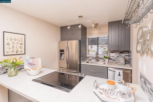 a kitchen with a refrigerator and a sink