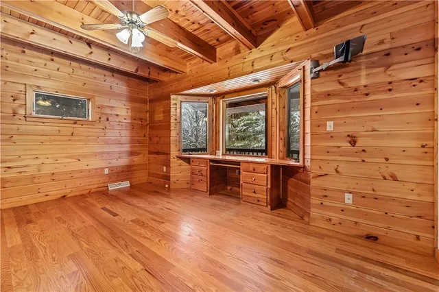 front view of a house with a large window