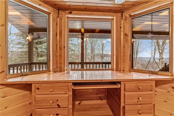 a kitchen with a sink and large window