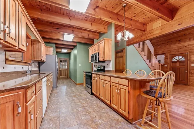 a view of a patio with table and chairs