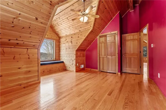 a view of a room with wooden floor and stairs