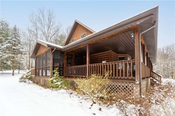 a backyard of a house with lots of green space and fence