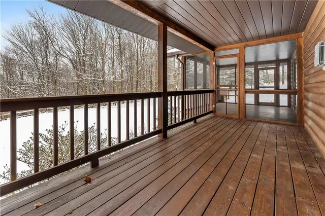 a view of wooden balcony with wooden floor