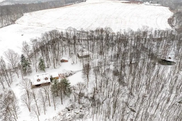 a view of a yard with wooden fence