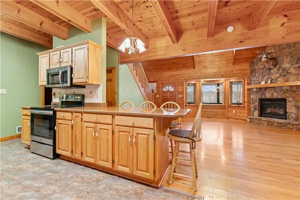 a view of a kitchen with furniture and a fireplace