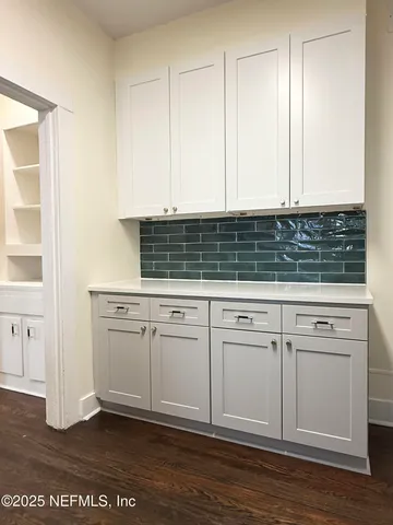 a view of wooden floor in an empty room
