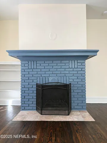 a fireplace with a vase on top of it