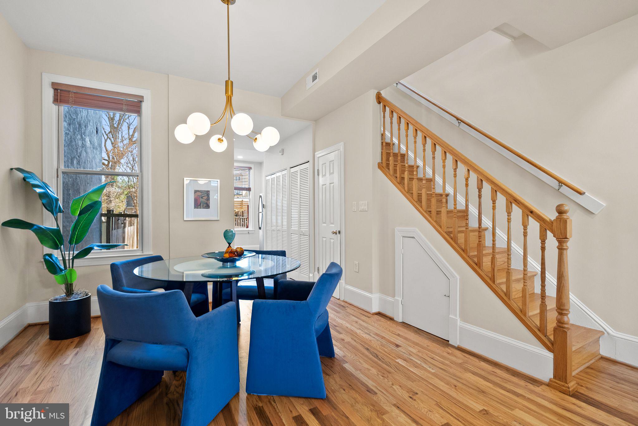 633 12th Street Northeast Washington, DC 20002 - Photo 11 of 44 a view of a dining room with furniture a chandelier and wooden floor