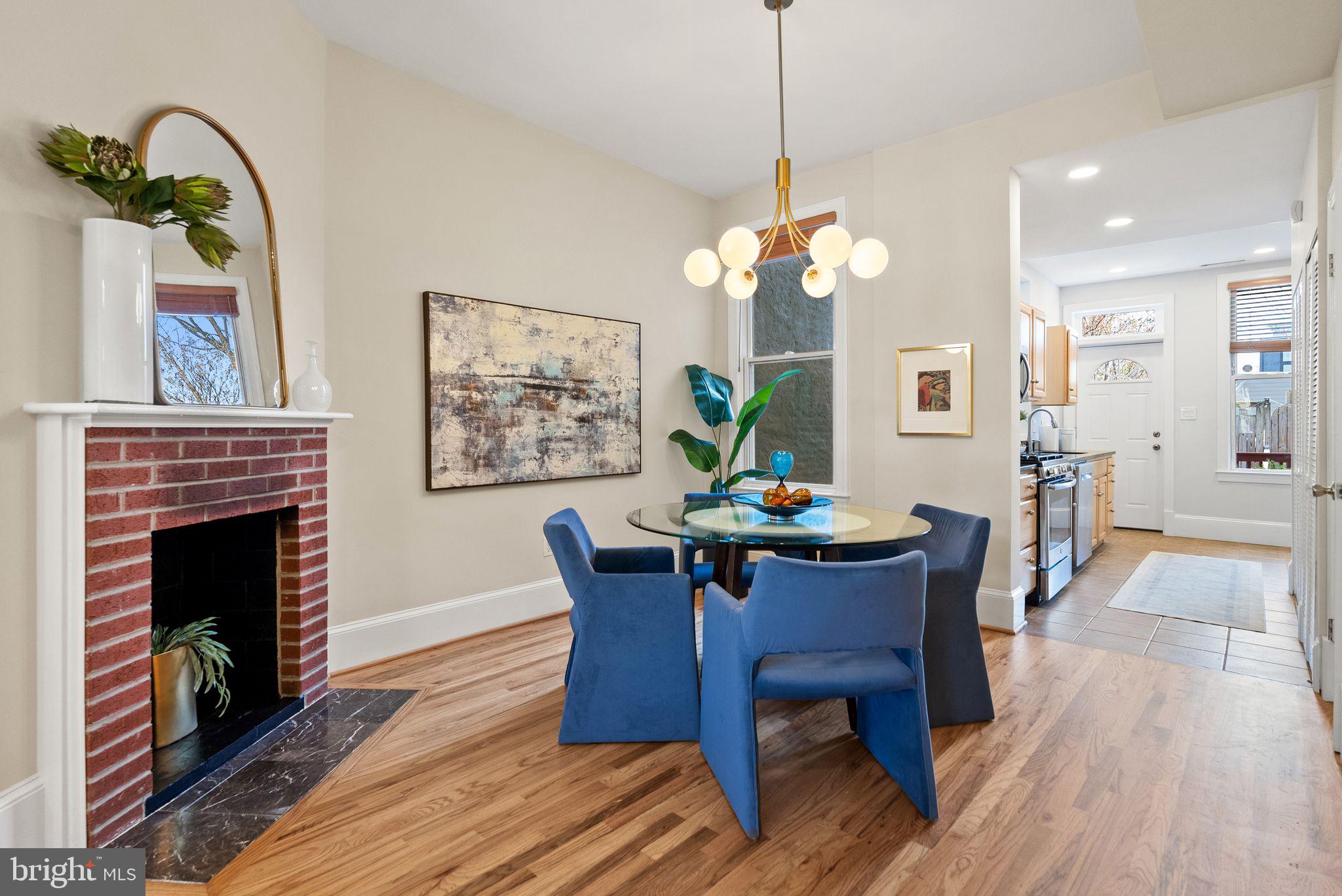 633 12th Street Northeast Washington, DC 20002 - Photo 12 of 44 a dining room with furniture a chandelier and wooden floor
