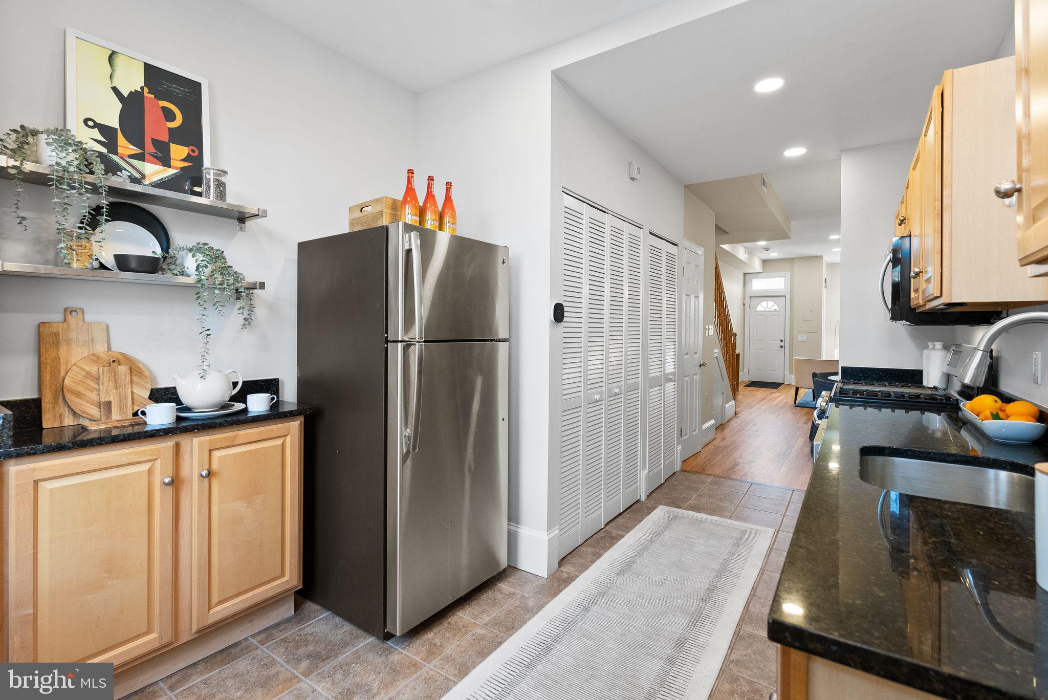633 12th Street Northeast Washington, DC 20002 - Photo 15 of 44 a kitchen with stainless steel appliances granite countertop a refrigerator and a sink