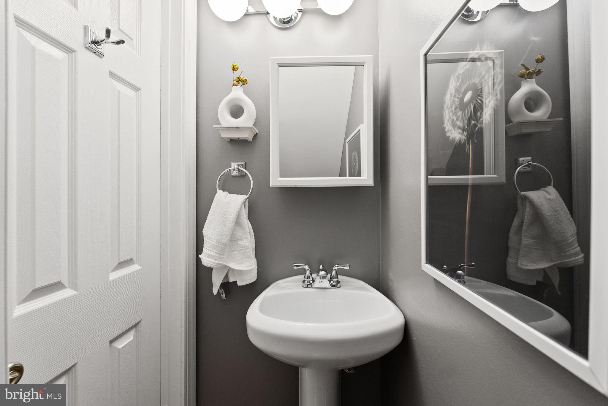 633 12th Street Northeast Washington, DC 20002 - Photo 17 of 44 a bathroom with a sink and mirror